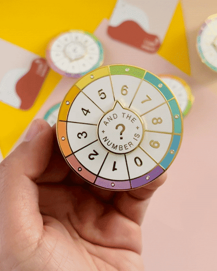 Spinning Numbers Enamel Pin