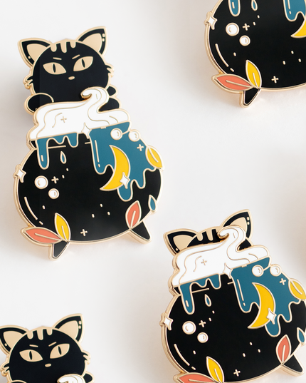 interactive enamel pin black cat in a cauldron design