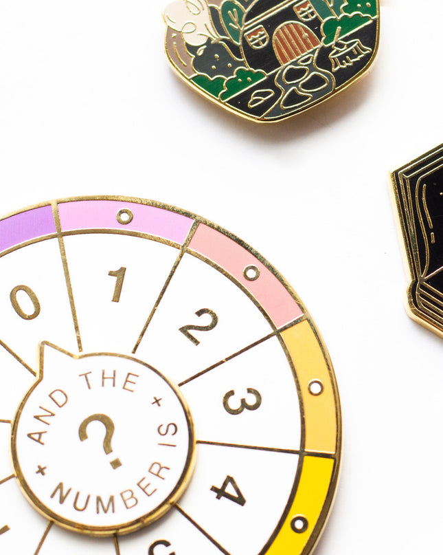 Spinning Numbers Enamel Pin