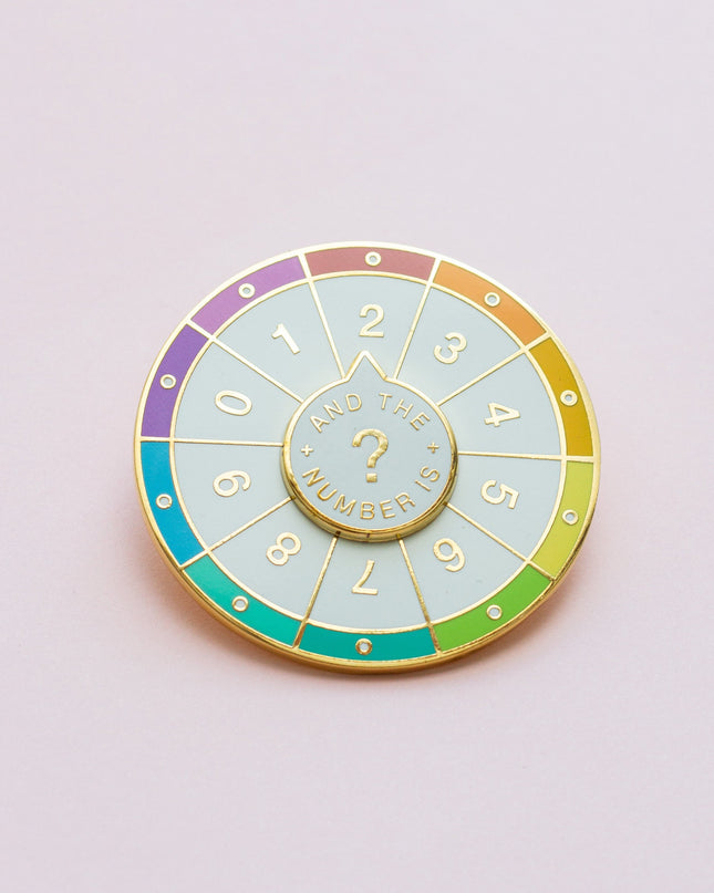 Spinning Numbers Enamel Pin