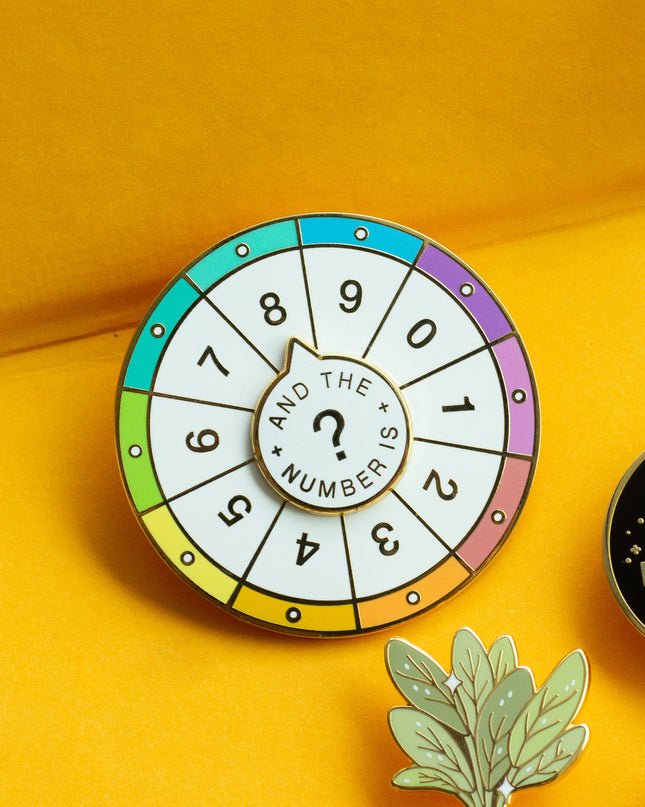 Spinning Numbers Enamel Pin