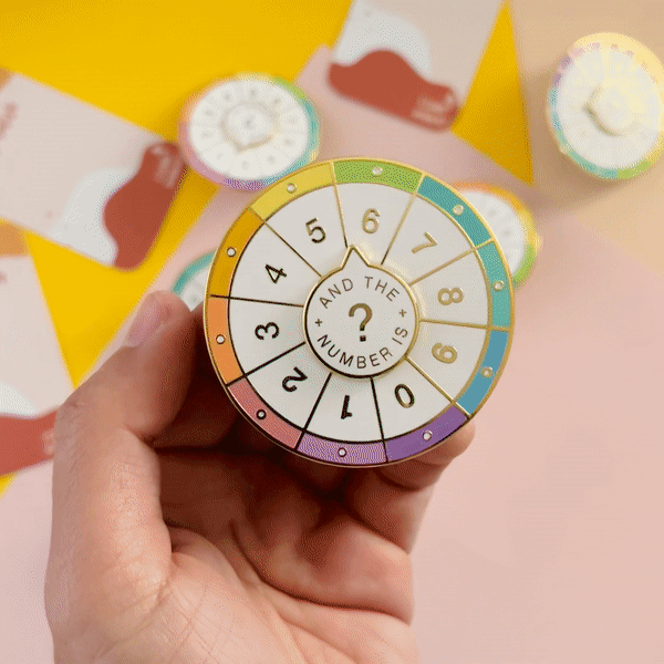 Spinning Numbers Enamel Pin
